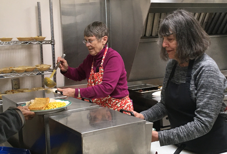 Volunteer helpers preparing meals